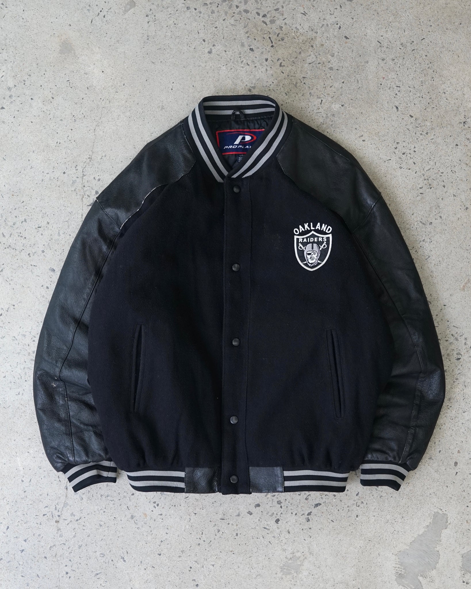 oakland raiders varsity jacket
