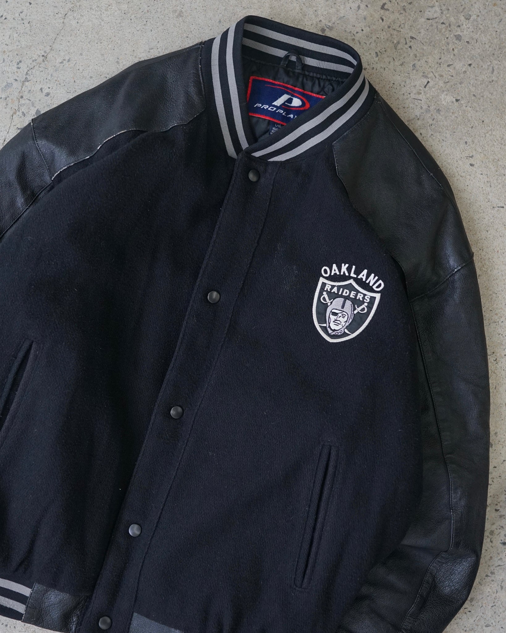 oakland raiders varsity jacket