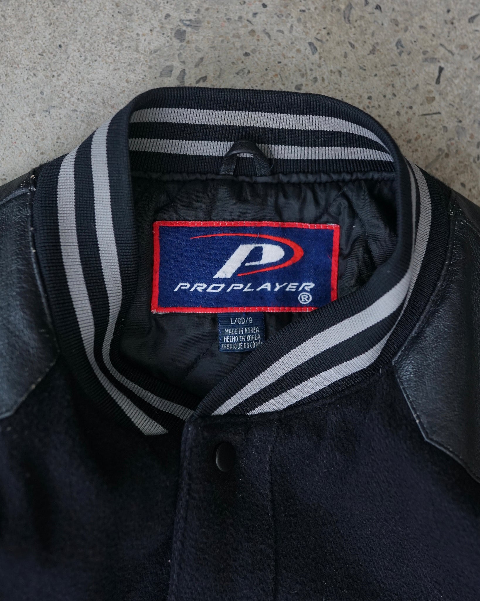 oakland raiders varsity jacket