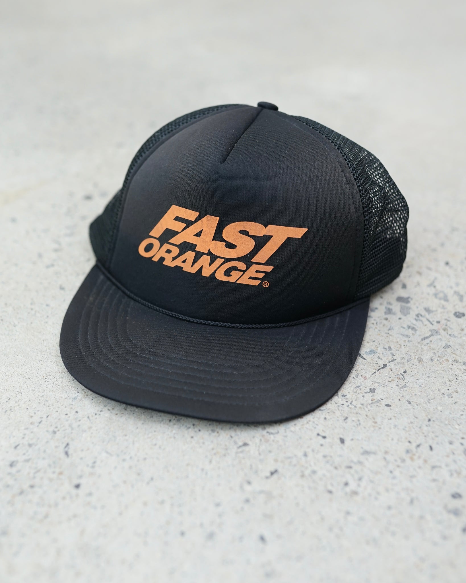 fast orange trucker hat